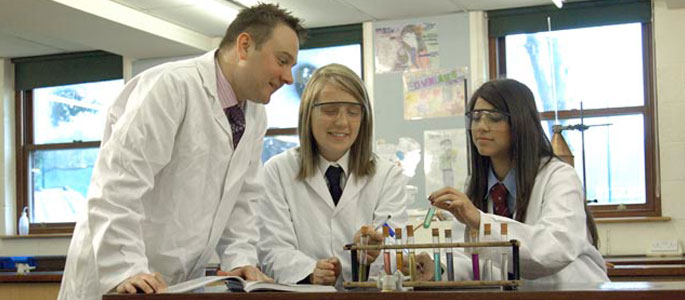 Students with teacher in Science class