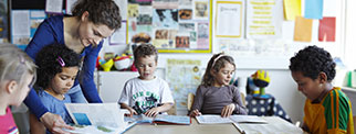 Teacher with young children in class