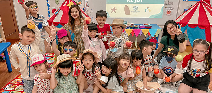 A group of young children in a classroom