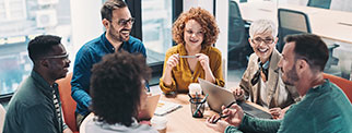 Group of adults talking round a table