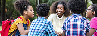 Young people sat outside having a conversation