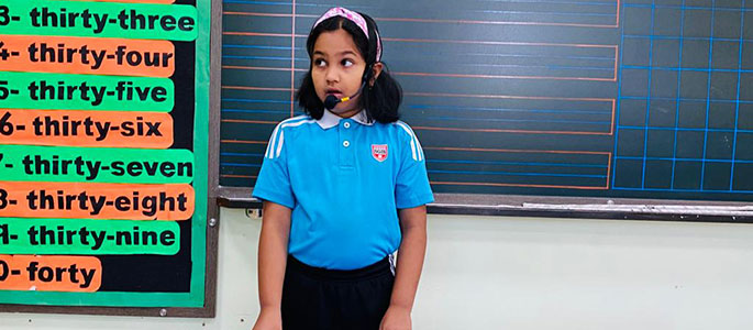 Child in front of a board