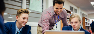 Students looking at information on a computer