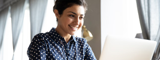 Person working at a laptop promo 